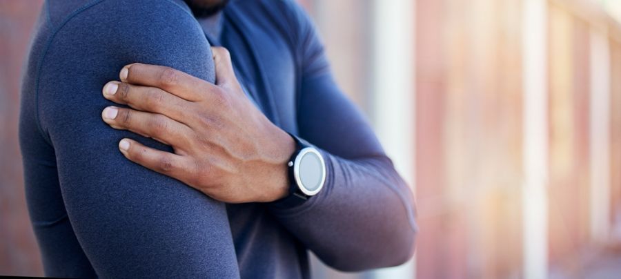A man holding his shoulder